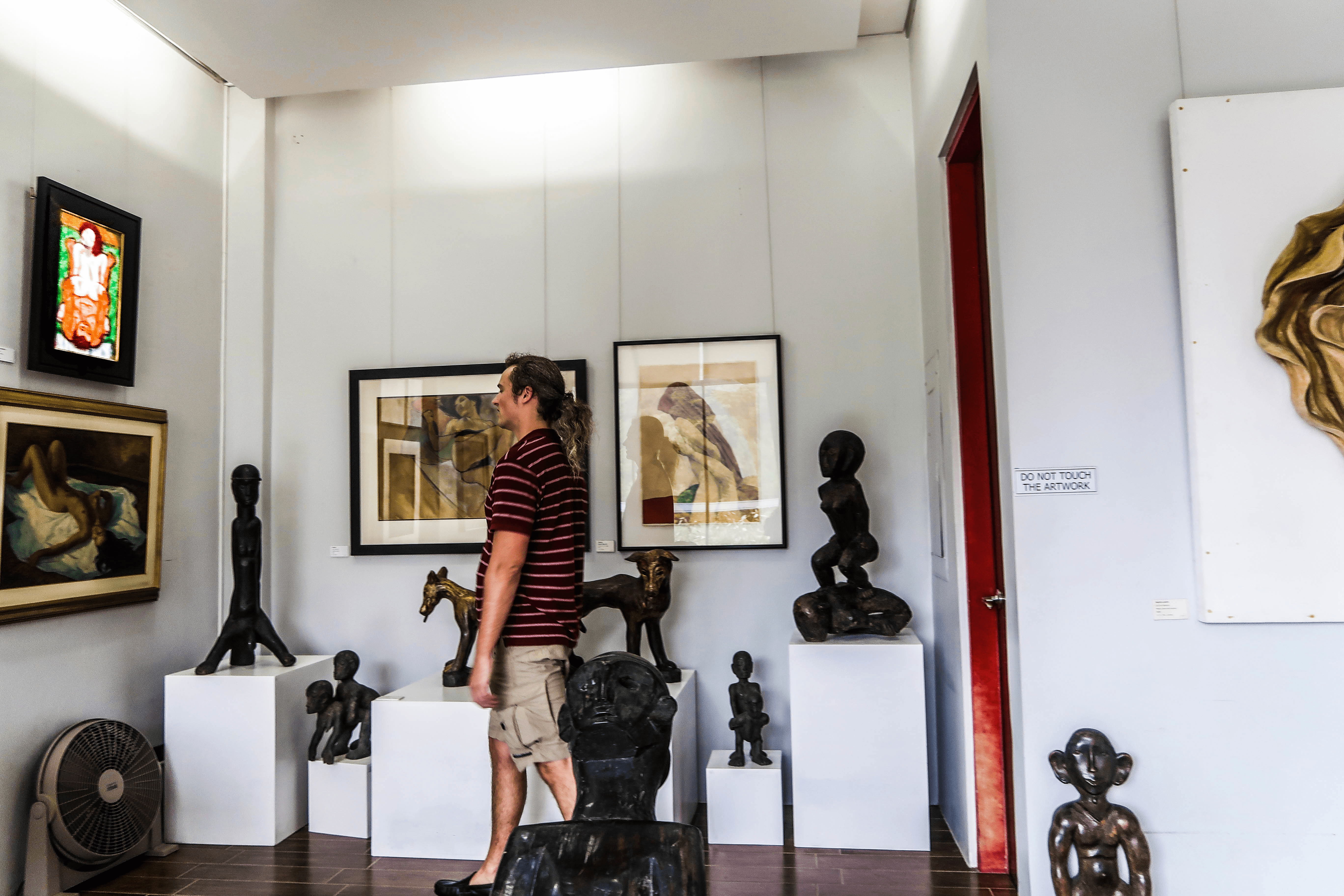 lenny through paradise in awe of a painting in the erotica room in bencab museum in baguio city philippines